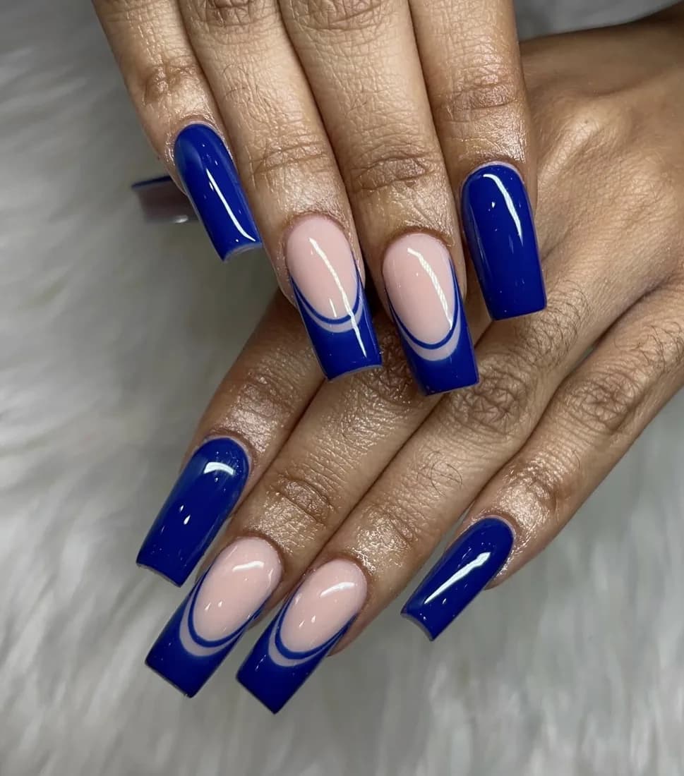 Square nails with a bold cobalt blue French tip