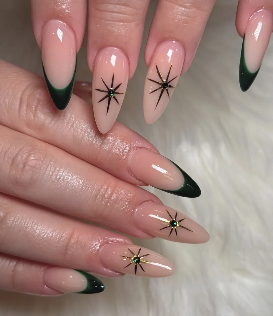 Deep green French tips with gold celestial star detailing