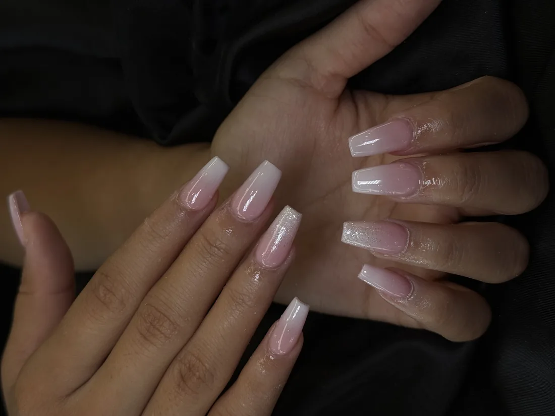 Long square nails in a natural nude finish