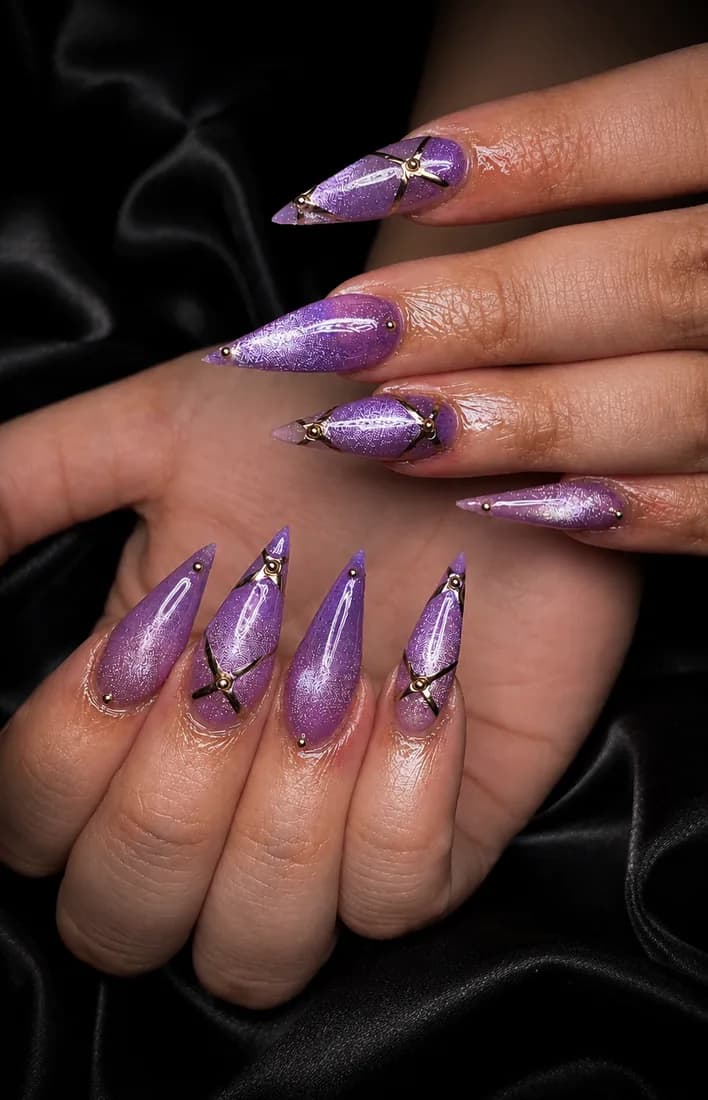 Stiletto nails in purple chrome with a marbled finish